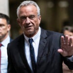 Independent presidential candidate Robert F. Kennedy Jr., waves to the media outside the Nassau County Supreme Court in Mineola, N.Y. on Wednesday, Aug., 21, 2024.