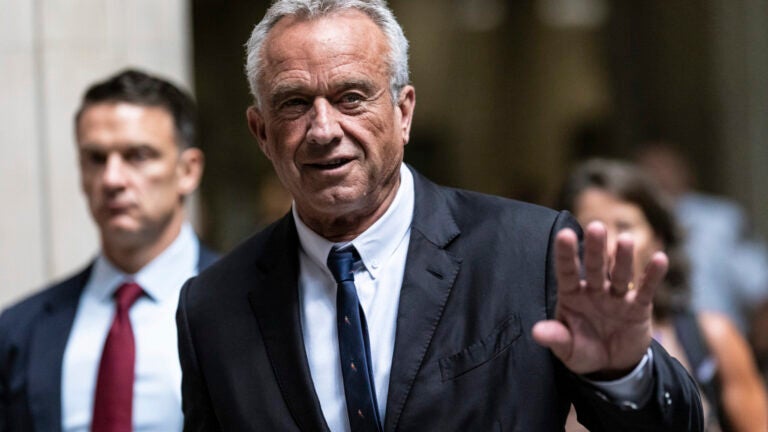 Independent presidential candidate Robert F. Kennedy Jr., waves to the media outside the Nassau County Supreme Court in Mineola, N.Y. on Wednesday, Aug., 21, 2024.