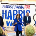 Democratic presidential nominee Vice President Kamala Harris speaks as second gentleman Doug Emhoff, from left, Democratic vice presidential nominee Minnesota Gov. Tim Walz and his wife Gwen Walz listen at a campaign event, Sunday, Aug. 18, 2024, in Rochester, Pa.