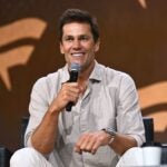 NEW YORK, NEW YORK - AUGUST 16: Tom Brady speaks at the Fanatics Fest NYC 2024 at Jacob Javits Center on August 16, 2024 in New York City.
