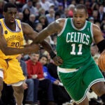 Glen Davis of the Celtics drives the ball past Golden State's Ekpe Udoh during a 2011 game in Oakland, Calif.