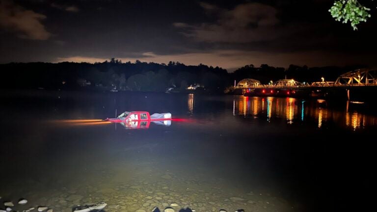 Truck rolls off boat ramp into Merrimack River