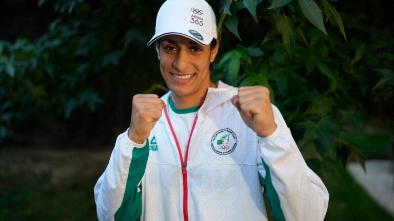 Algerian boxer Imane Khelif poses for a photo after an interview with SNTV at the 2024 Summer Olympics.