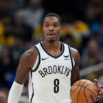 Brooklyn Nets' Lonnie Walker IV dribbles during the first half of an NBA basketball game against the Indiana Pacers, Monday, April 1, 2024, in Indianapolis.