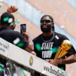 Jaylen Brown celebrates during a duck boat parade to celebrate the 18th Boston Celtics NBA championship on Friday, June 21, 2024. The Celtics defeated the Dallas Mavericks in Game 5 of the NBA Finals.