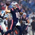 Patriots quarterback Drake Maye throws a pass during the first half.