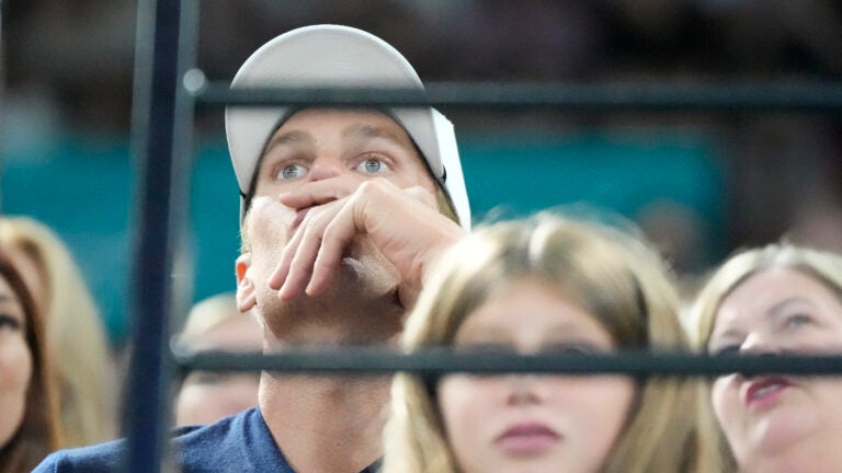 Retired American NFL football star Tom Brady, right, watches during the artistic gymnastics individual apparatus finals at Bercy Arena at the 2024 Summer Olympics.