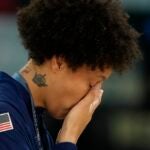 United States' Brittney Griner wipes a tear after a women's gold medal basketball game at Bercy Arena at the 2024 Summer Olympics.