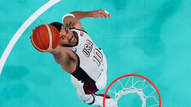 Jayson Tatum, of the United States, grabs a rebound against South Sudan at the 2024 Summer Olympics.