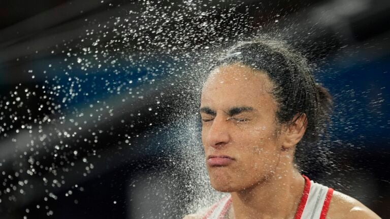 Algeria's Imane Khelif prepares to fight China's Yang Liu in their women's 66 kg final boxing match at the 2024 Summer Olympics.