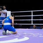 Italy's Angela Carini reacts after abandoning her fight against Algeria's Imane Khelif in their women's 66kg preliminary boxing match at the 2024 Summer Olympics.