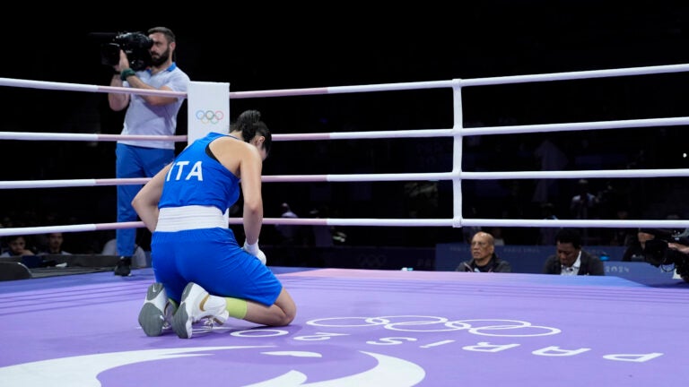 Italy's Angela Carini reacts after abandoning her fight against Algeria's Imane Khelif in their women's 66kg preliminary boxing match at the 2024 Summer Olympics.