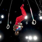 Frederick Richard performs on the rings during the men's artistic gymnastics all-around finals at the Paris Olympics.
