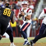 New England Patriots quarterback Drake Maye (10) throws during an NFL football game against the Washington Commanders, Sunday, August 25, 2024 in Landover, Md.