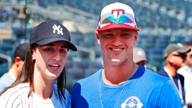 WNBA basketball player Caitlin Clark and Texas Rangers Josh Jung before a baseball double header game between the Yankees and the Rangers.