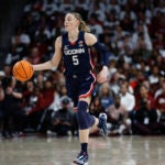 UConn guard Paige Bueckers brings the ball up court during the second half of an NCAA college basketball game against South Carolina in Columbia.