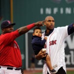 Four-time All-Star and newest Boston Celtics NBA free agent signee Al Horford, holding son Ean, 16 months, with Boston Red Sox designated hitter David Ortiz (34) after throwing out the ceremonial first pitch before the Boston Red Sox take on the Tampa Bay Rays at Fenway Park. Ortiz caught the ceremonial pitch. The Boston Red Sox take on the Tampa Bay Rays in Game 1of a 3 game series at Fenway Park.