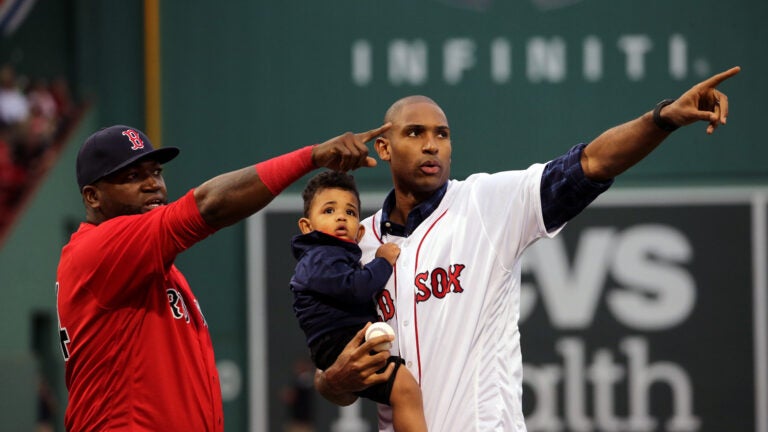 Four-time All-Star and newest Boston Celtics NBA free agent signee Al Horford, holding son Ean, 16 months, with Boston Red Sox designated hitter David Ortiz (34) after throwing out the ceremonial first pitch before the Boston Red Sox take on the Tampa Bay Rays at Fenway Park. Ortiz caught the ceremonial pitch. The Boston Red Sox take on the Tampa Bay Rays in Game 1of a 3 game series at Fenway Park.