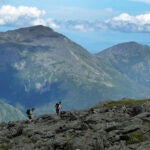 A pair of hikers traverse a trail on Mount Washington, N.H.