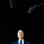 President Joe Biden talks with reporters.