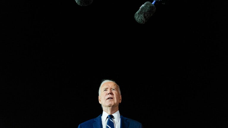 President Joe Biden talks with reporters.