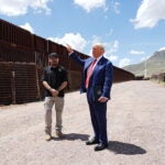 Former President Donald Trump, right, the Republican nominee for president, tours a section of the border wall in Sierra Vista, Ariz., with Paul Perez, head of the labor union representing workers at the U.S. Border Patrol.