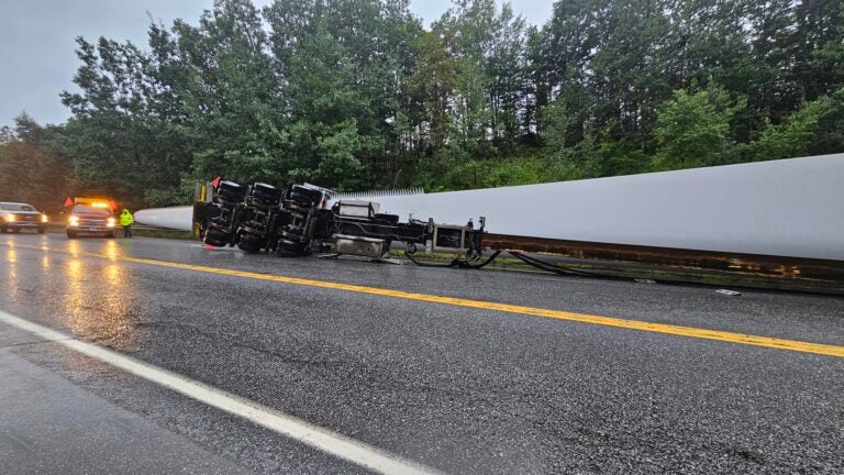 Huge wind turbine blade lands on highway after truck hits bridge in Maine