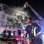 Firefighters on the scene of a multi-alarm fire that damaged a four story, multi apartment building in Chelsea on Wednesday morning.