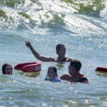 Lifeguards at Cisco Beach help pull swimmers out of churned up surf off Nantucket.