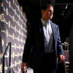 Boston Bruins General Manager Don Sweeney walked off of the stage after speaking to reporters during the annual start-of-season press conference at TD Garden.