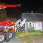 A driver was hospitalized Sunday evening after crashing into a home in Wareham, police said.