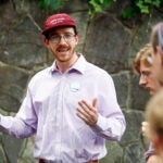 Evan MacKay, a Democratic candidate running for state representative in the 25th Middlesex District, talks to volunteers before canvassing in Cambridge in July.