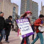 Boston University graduate worker students and supporters walked a picket line outside of BU’s Marsh Chapel in March.