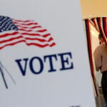 Lyell Williams of Chesterfield, N.H., fills out his ballot during the New Hampshire state primaries.