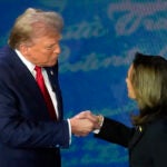 Republican presidential nominee former President Donald Trump shakes hands with Democratic presidential nominee Vice President Kamala Harris shake hands on the debate stage.