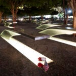 Flowers and a flag adorn one of the memorial benches outside the Pentagon.