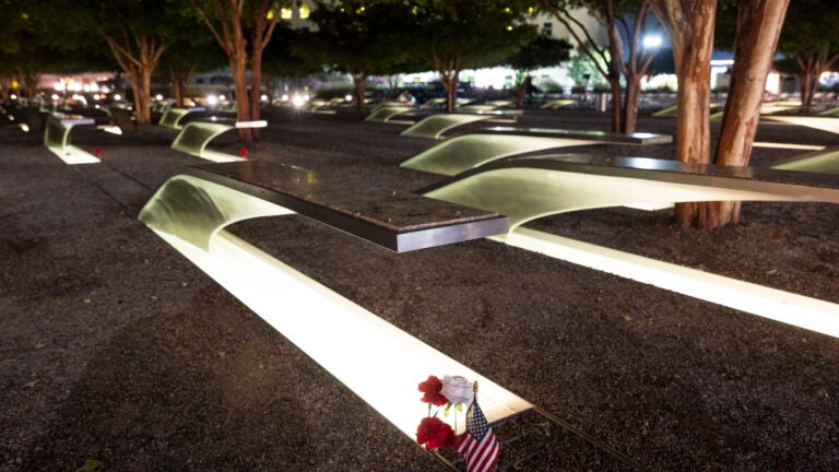 Politics tamfitronics Flowers and a flag adorn one of the memorial benches outside the Pentagon.