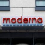A sign marks an entrance to a Moderna building in Cambridge, Mass.