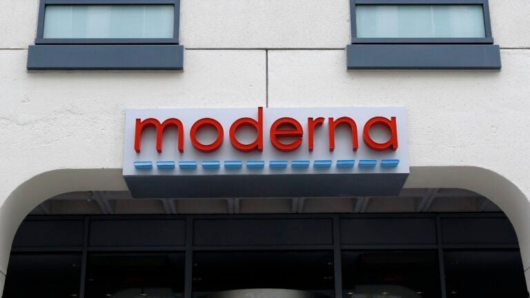 A sign marks an entrance to a Moderna building in Cambridge, Mass.