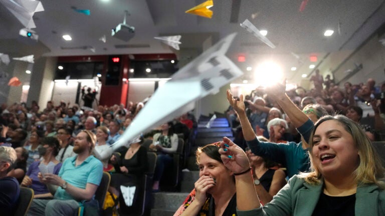 People in the audience throw paper airplanes toward the stage during a performance at the Ig Nobel Prize ceremony at Massachusetts Institute of Technology in Cambridge.