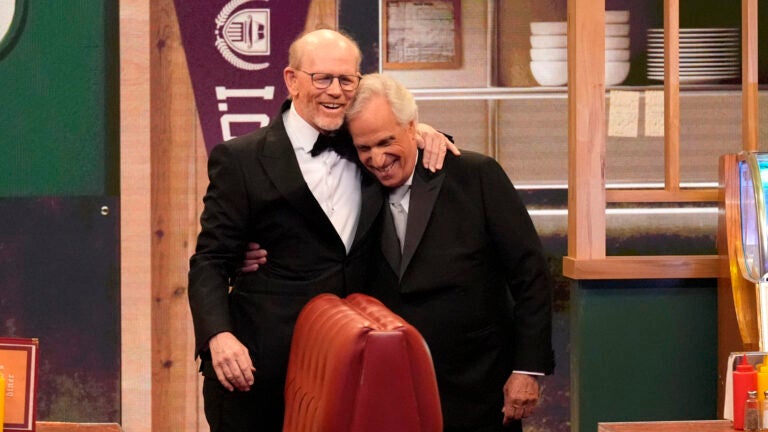 Ron Howard, left, and Henry Winkler present an award at the Emmys.