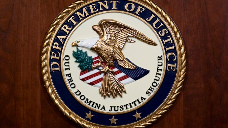 The seal of the Department of Justice.