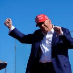 Republican presidential nominee former President Donald Trump dances after speaking at a campaign rally.