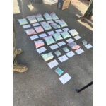 Seized counterfeit pills are displayed.