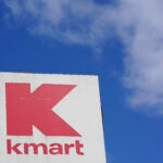 A large Kmart sign is displayed in front of a shopping plaza in Avenel, N.J.