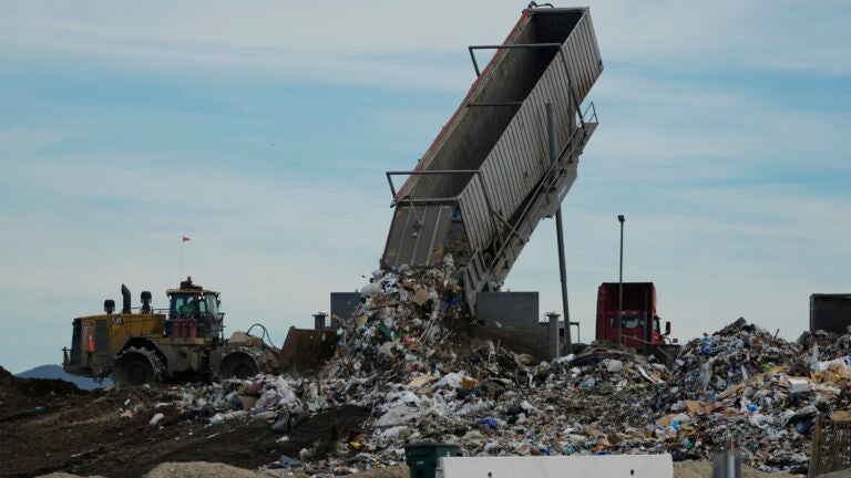 Trash is unloaded at the Otay Landfill in Chula Vista, Calif.