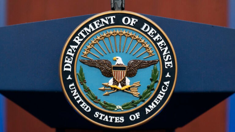 The seal of the Department of Defense is seen on the podium at the Pentagon.