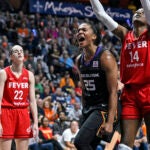 Alyssa Thomas celebrates a basket while being fouled during a game against the Indiana Fever.