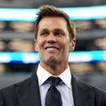 ARLINGTON, TEXAS - SEPTEMBER 15: Tom Brady looks on prior to the game at AT&T Stadium on September 15, 2024 in Arlington, Texas.