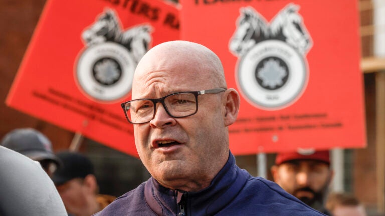 Sean O'Brien, General President, International Brotherhood of Teamsters, speaks to media as picketing rail workers gather at the CPKC headquarters in Calgary, Alta., Friday, Aug. 23, 2024.